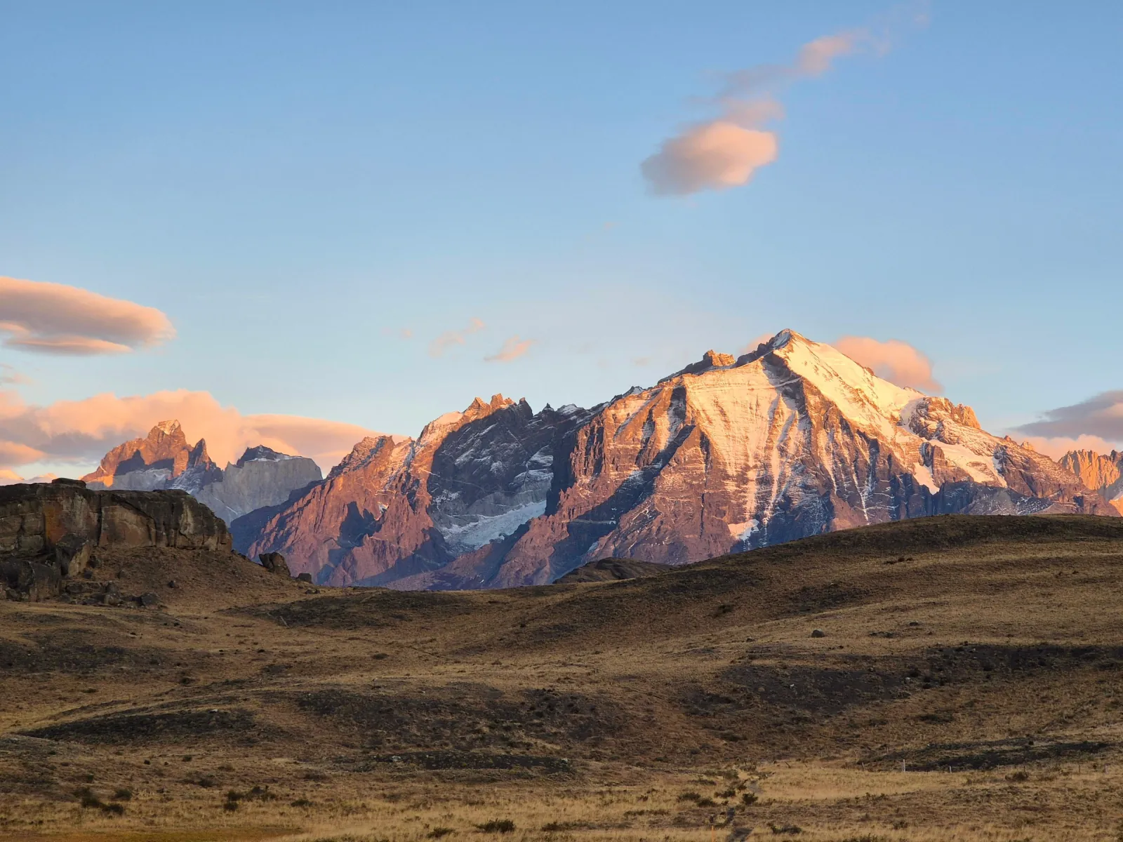 Alpenglow on the Paine Massif across the steppe