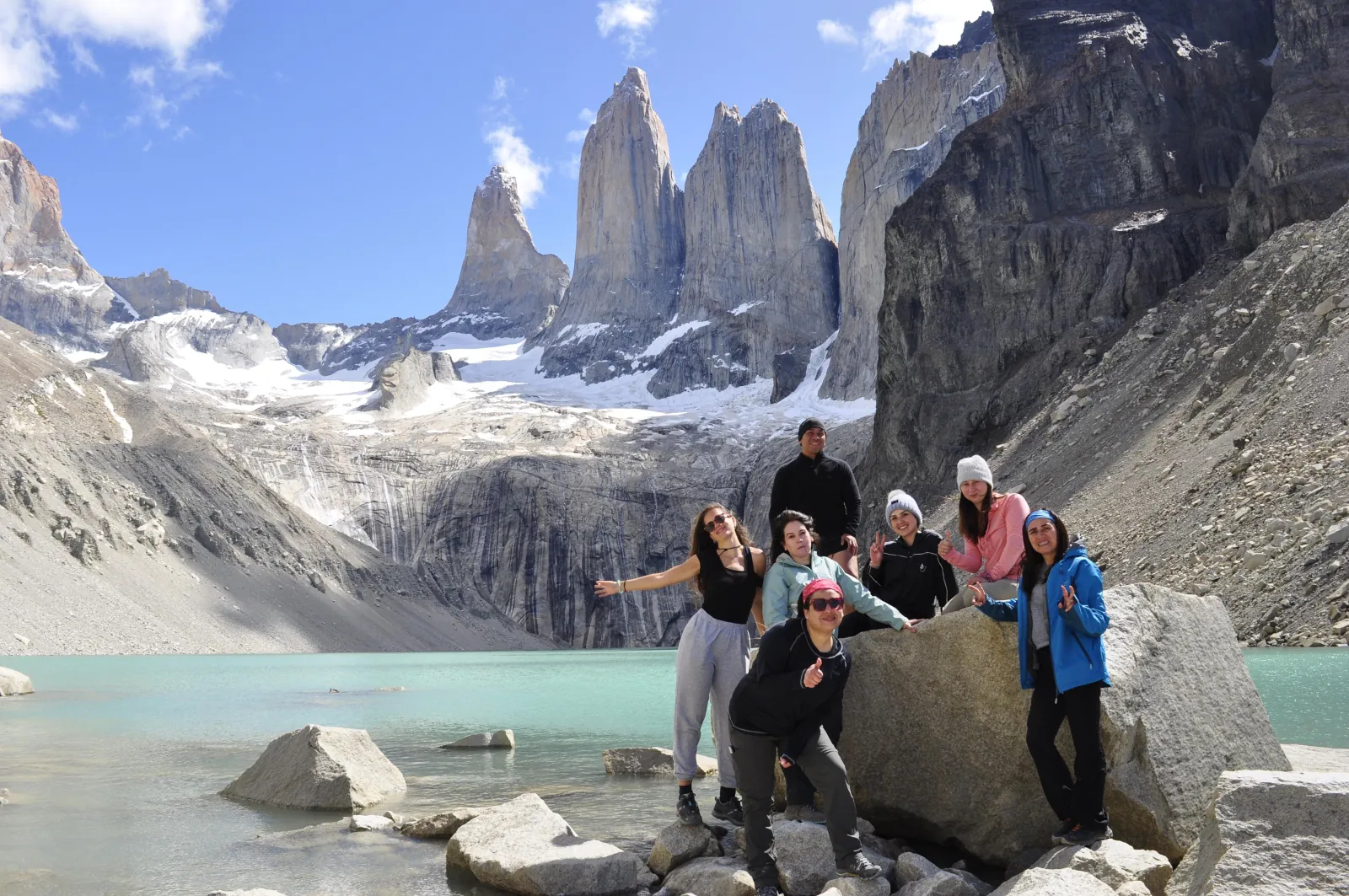Hiking group celebrating at the Base Torres viewpoint
