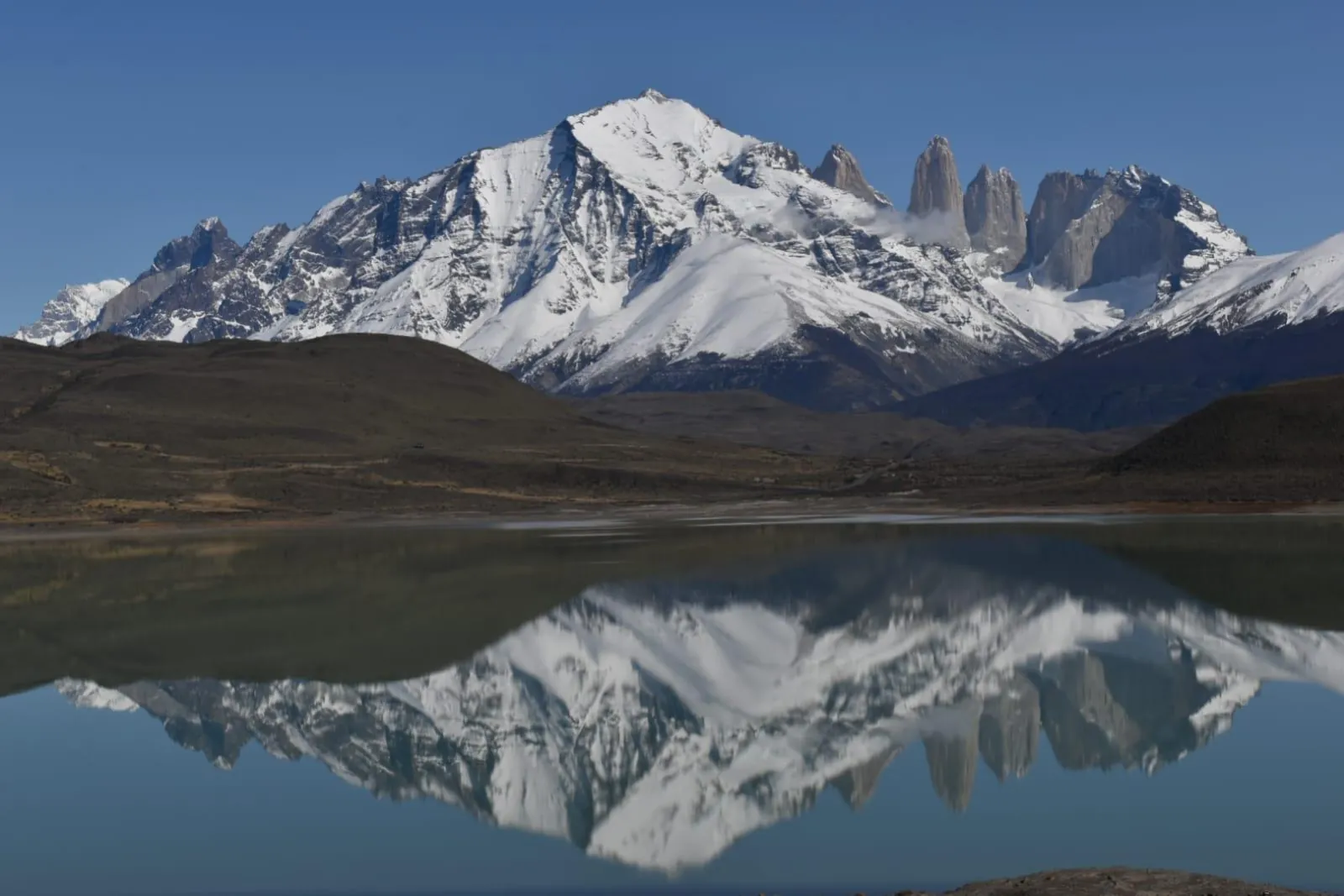 The towers reflected in Laguna Amarga